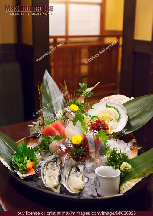 Sashimi and oysters at Japanese sushi restaurant. Stock Photo MXI26828