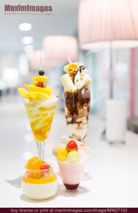 Stock photo of Parfaits on cafe table Buy commercial use license at MaximImages