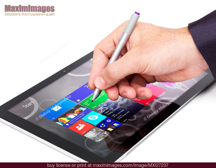 Person using Microsoft tablet Surface Pro 3. Stock Photo MXI27237