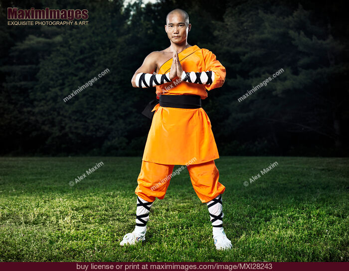 Stock photo of Shaolin warrior monk with hands in lotus position Buy commercial use license at MaximImages