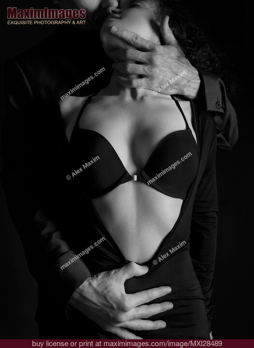 Stock photo of Beautiful sensual portrait of a couple. Man hands undressing a woman. Black and white Buy commercial use license at MaximImages