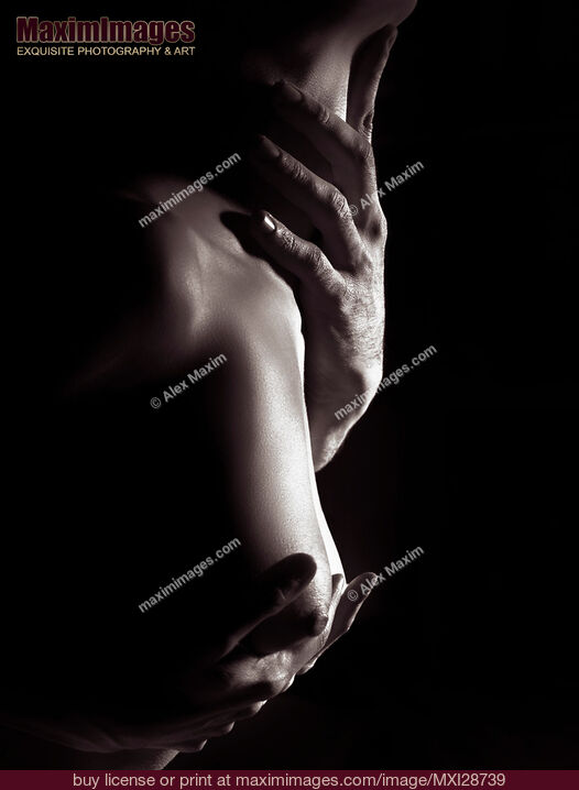 Stock photo of Sensual erotic closeup of man hands on nude woman breast and neck Buy commercial use license at MaximImages