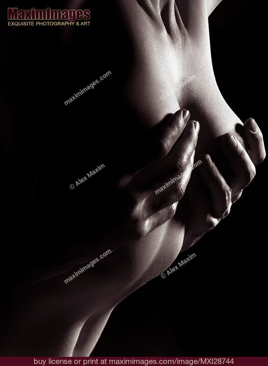 Stock photo of Sensual erotic closeup of man hands on nude woman breast Buy commercial use license at MaximImages