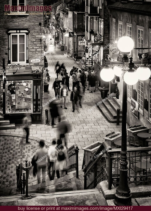Stock photo of Nightlife on historic streets of Old Quebec City Rue Sous-Le-Fort and Rue du Petit-Champlain Black and white Buy commercial use license at MaximImages