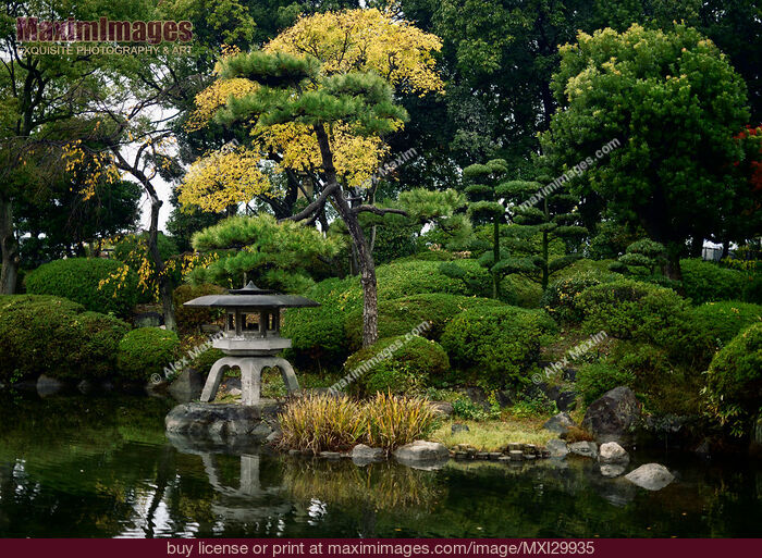 Stock photo of Little Japanese Zen garden with lantern and pond in Osaka Castle Park Buy commercial use license at MaximImages