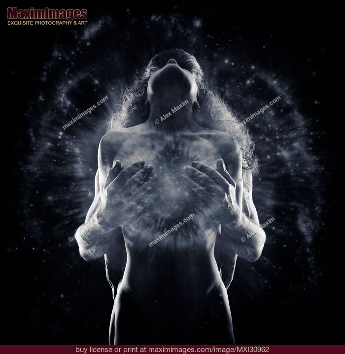 Stock photo of Tantra and sacred sensuality spiritual concept of a couple making love with Tantric energy glow Buy commercial use license at MaximImages