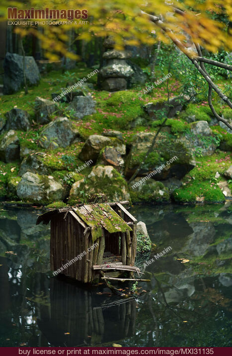 Stock photo of Tranquil scenery of Tenjuan Temple Japanese Zen pond garden moss covered landscape Buy commercial use license at MaximImages