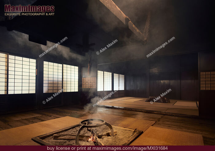 Stock photo of Traditional Japanese Gassho house interior with an open fire pit Irori fireplace Buy commercial use license at MaximImages