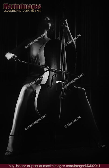 Stock photo of Woman passionately playing cello Dramatic dark contrast black and white portrait Buy commercial use license at MaximImages