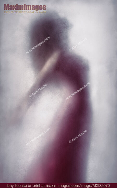 Stock photo of Woman in red dress graceful silhouette suspended in leaping motion behind a veil of bright white foggy haze Buy commercial use license at MaximImages
