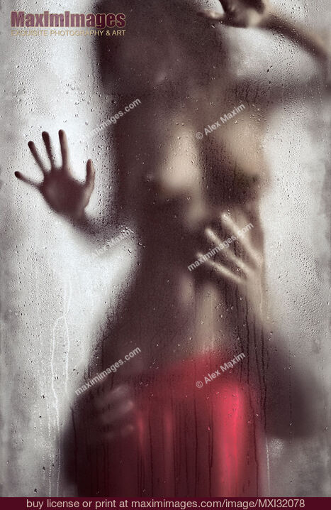 Stock photo of Man hands caressing woman half naked body Sensual couple behind wet glass Buy commercial use license at MaximImages