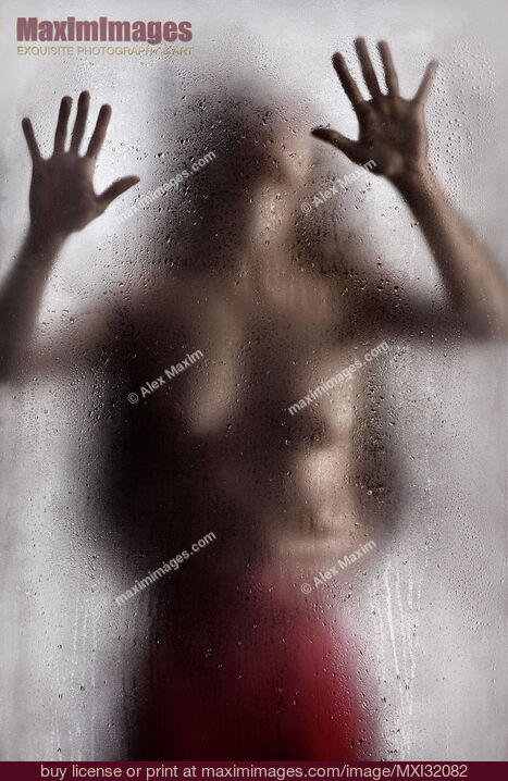 Stock photo of Half nude woman leaning against the glass with man hands around her waist Sensual couple making love Buy commercial use license at MaximImages