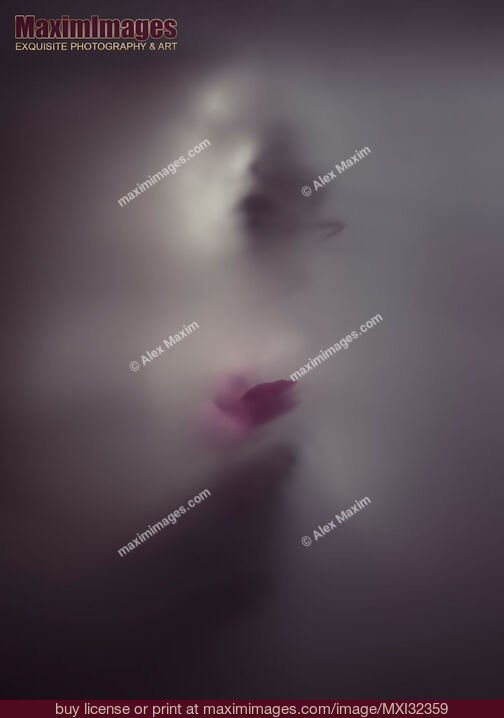 Stock photo of Ghostly woman face with a pink rose behind a veil of dense white suffocating fog Buy commercial use license at MaximImages
