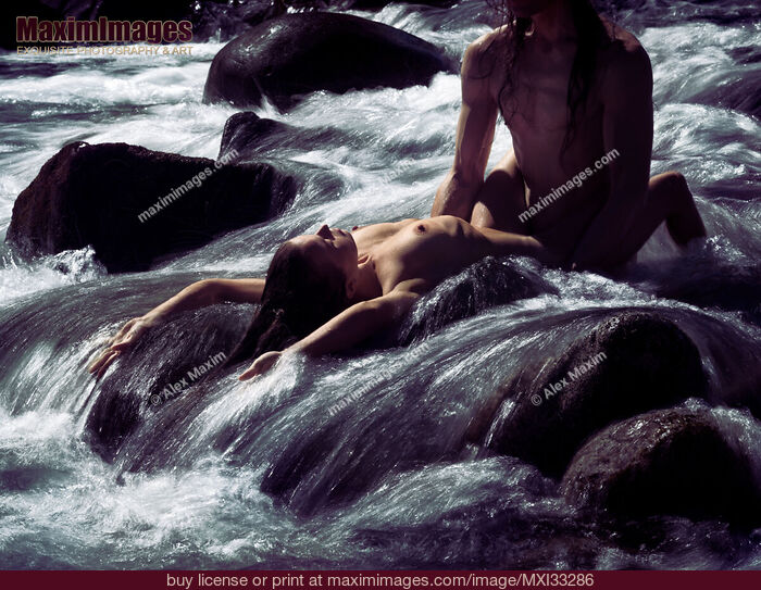 Stock photo of Sexy nude couple making love in wild water of a mountain river stream in beautiful nature scenery Buy commercial use license at MaximImages