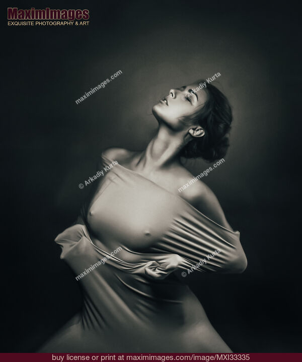 Stock photo of Woman in tight stretchy dress over naked body Black and white art nude dramatic expressive portrait Buy commercial use license at MaximImages