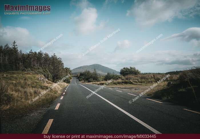 Stock photo of Highway in sunny landscape scenery Connemara Ireland Buy commercial use license at MaximImages