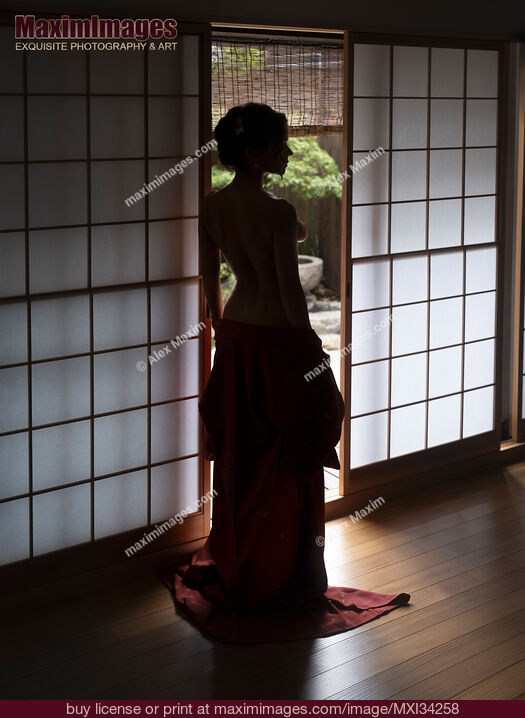 Stock photo of Beautiful half-nude woman with bared back standing by open shoji door of Japanese house with Zen garden Buy commercial use license at MaximImages