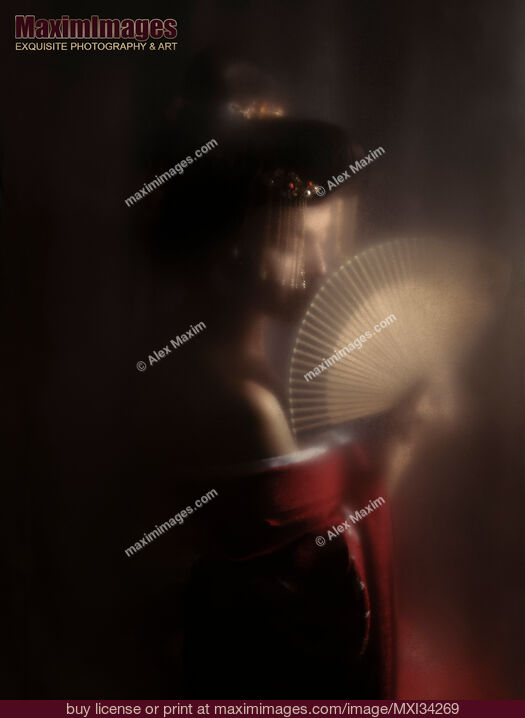 Stock photo of Mysterious portrait of beautiful Japanese geisha or courtesan Oiran with hand fan behind hazy screen Buy commercial use license at MaximImages