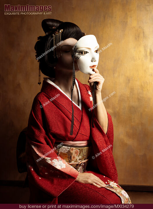 Stock photo of Portrait of beautiful geisha holding white theatrical mask in her hand in front of her face Buy commercial use license at MaximImages