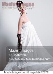 Beautiful Woman with a Creative Hairstyle Wearing a Long White Dress... preview image
