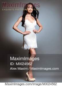 Beautiful young woman wearing white dress... preview image