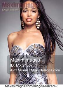 Young woman wearing fancy shiny dress... preview image
