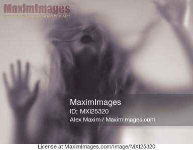 Dramatic photo of woman blurred silhouette behind hazy glass... preview image