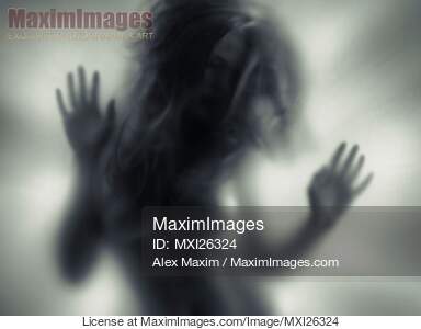 Woman blurred silhouette behind glass... preview image