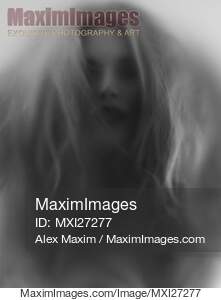Beautiful young woman face behind hazy glass... preview image