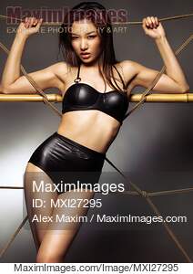 Sexy asian woman wearing stylish black bikini swimsuit... preview image