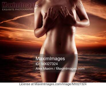 Beautiful nude woman coming out of the water... preview image