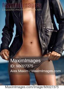 Closeup of sexy woman body in leather jacket and bikini... preview image