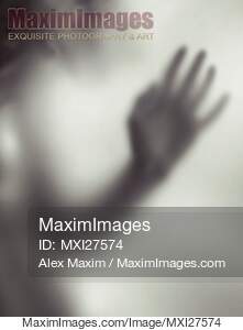Woman blurred hand behind glass... preview image