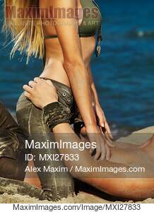 Sexy young couple making love on the beach... preview image