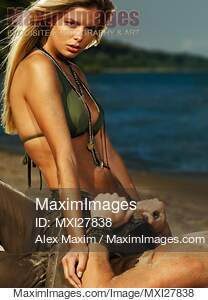 Sensual couple portrait at a sandy beach... preview image
