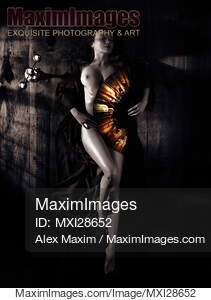 Beautiful naked woman covering her body with fan artistic...... preview image