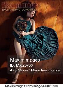 Sensual portrait of woman in green dress with bare legs...... preview image