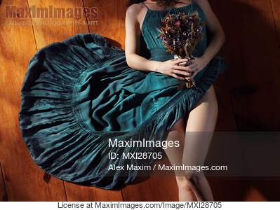 Sensual portrait of woman in blue dress with bare legs...... preview image