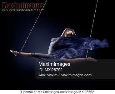 Beautiful naked woman suspended in a split with bondage...... preview image
