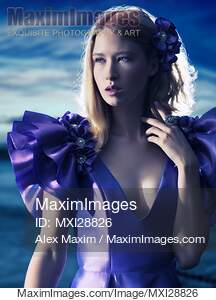 Beautiful blond woman in blue dress beauty portrait... preview image