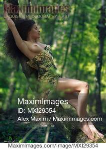Beautiful half naked sexy young woman leaning against a...... preview image