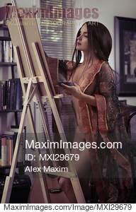 Fine art nude portrait of young woman artist painting naked...... preview image