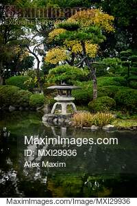 Japanese Zen garden with lantern and pond in Osaka Castle Park... preview image