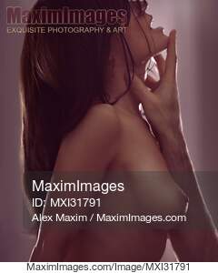 Man's hand caressing neck and face of a nude woman...... preview image