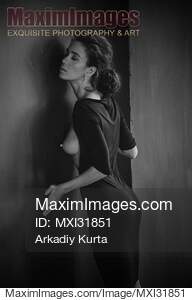 Sensual portrait of a woman in black dress revealing her...... preview image