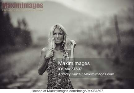 Expressive portrait of a blond woman in a summer dress...... preview image
