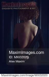 Sensual boudoir portrait a woman in black dress with low...... preview image