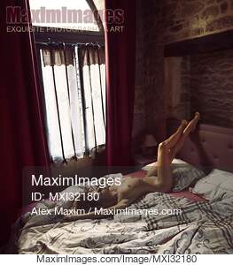 Artistic erotic portrait of a nude sexy woman lying relaxed...... preview image