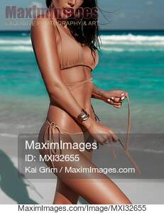 Sexy woman in bikini swimsuit at the beach closeup of her...... preview image