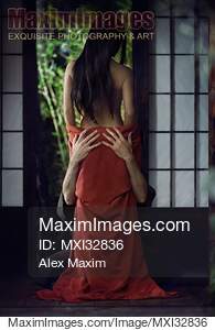 Sensual romantic Asian couple in traditional clothes making...... preview image